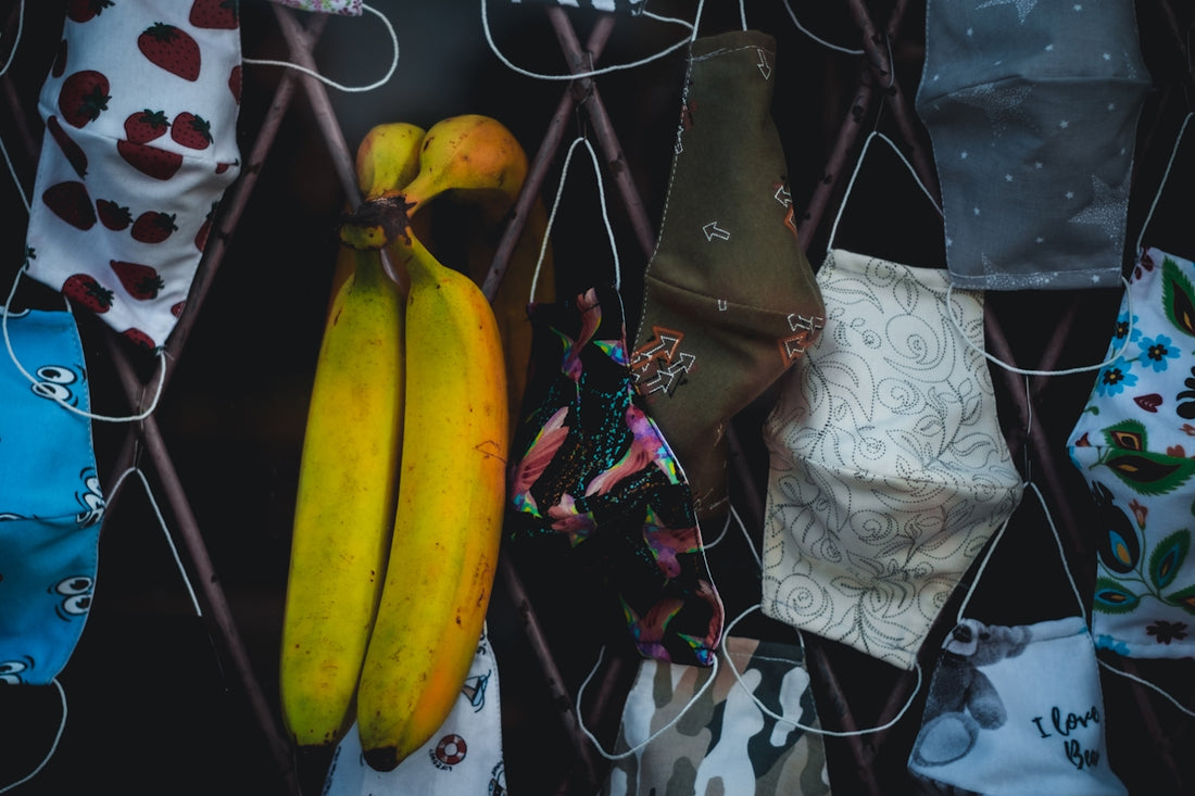 yellow banana fruit on white and black textile