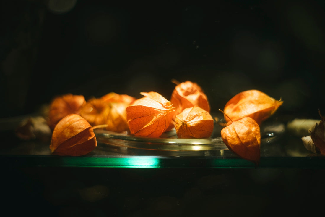 a group of oranges on a plate